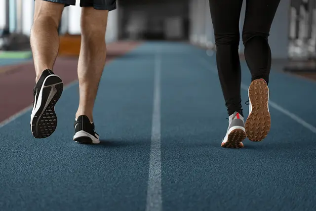 Runner's foot rolling inward during the stride, showing natural pronation